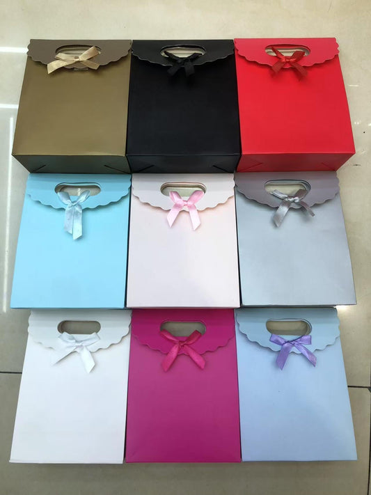 BOLSA REGALO M LAZO 19*9*27CM